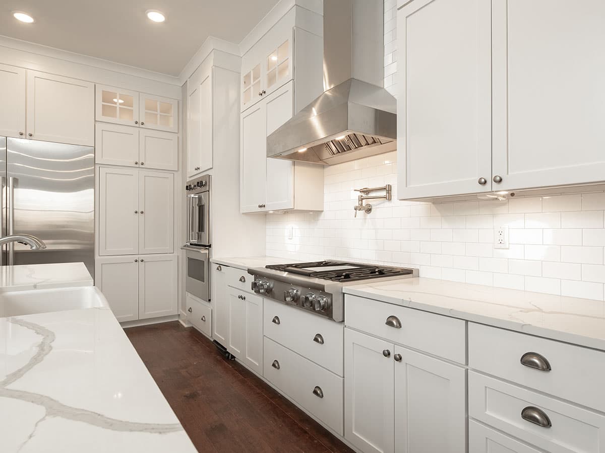 fully white kitchen with oven